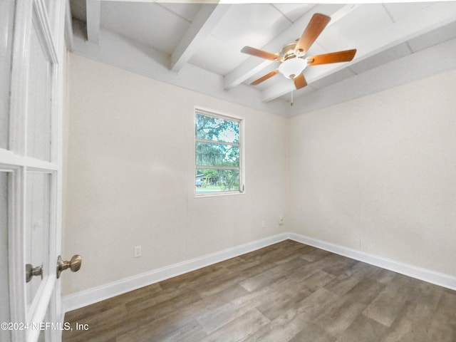 empty room with beamed ceiling, wood-type flooring, and ceiling fan