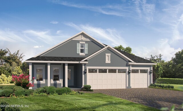 view of front of home with a porch, a front yard, and a garage