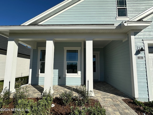 property entrance featuring covered porch