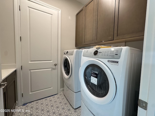 laundry room with cabinet space and washer and dryer