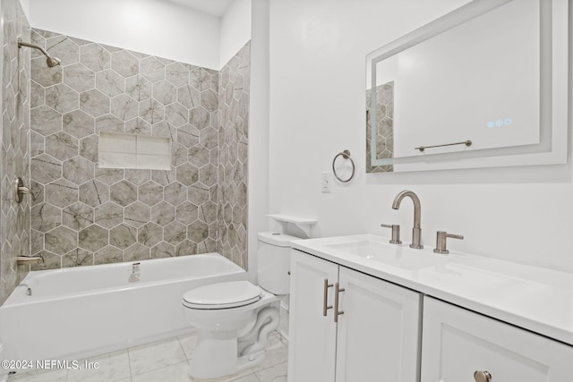 full bathroom featuring tiled shower / bath combo, vanity, and toilet