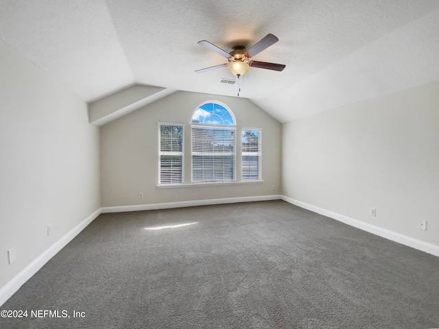 bonus room with ceiling fan, carpet flooring, a textured ceiling, and vaulted ceiling