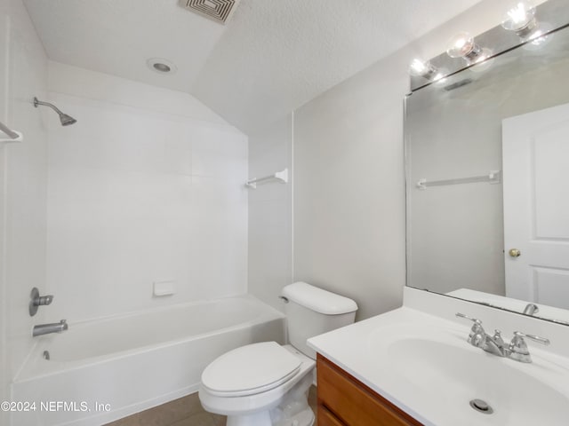 full bathroom featuring a textured ceiling, toilet, tile patterned floors, vanity, and tub / shower combination