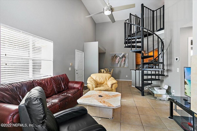 living room with high vaulted ceiling, light tile patterned floors, and ceiling fan