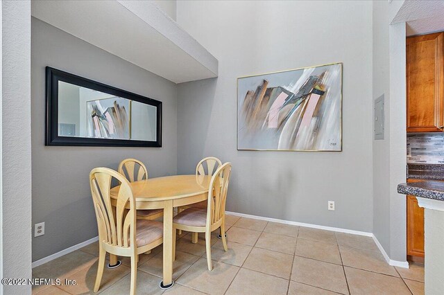 dining area with light tile patterned floors