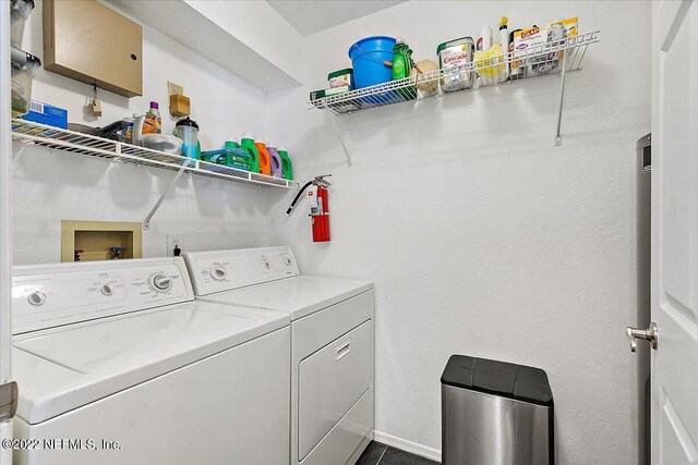 laundry room featuring washing machine and clothes dryer