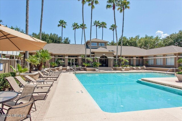 view of swimming pool featuring a patio area