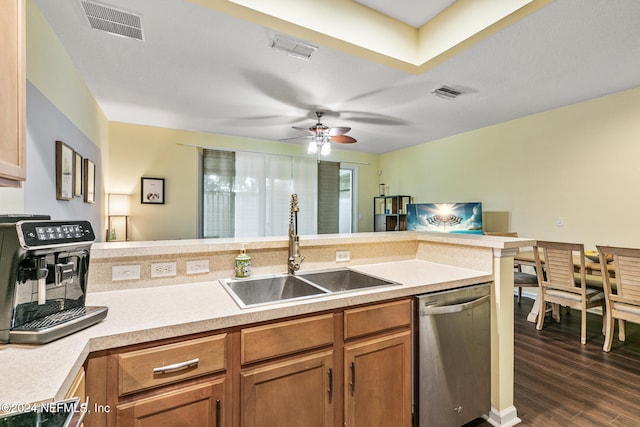 kitchen featuring ceiling fan, dark hardwood / wood-style flooring, dishwasher, sink, and kitchen peninsula