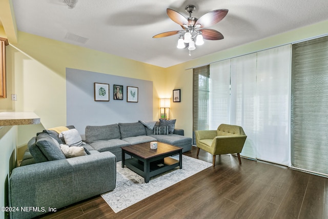 living room featuring hardwood / wood-style flooring and ceiling fan