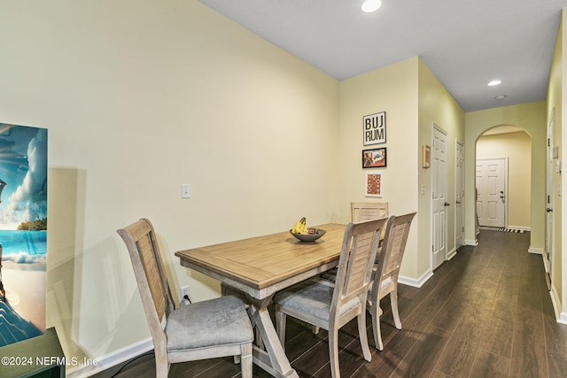 dining space featuring dark wood-type flooring