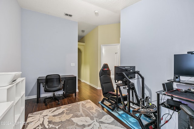 office featuring a textured ceiling and dark hardwood / wood-style floors