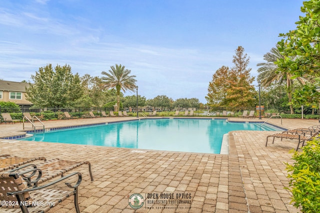 view of pool featuring a patio