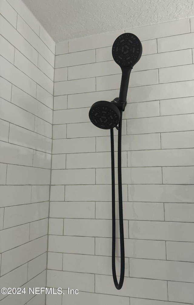 details featuring a tile shower