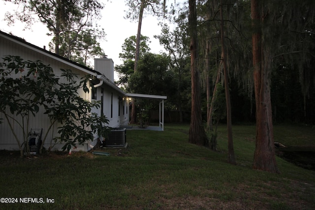 view of yard featuring central air condition unit