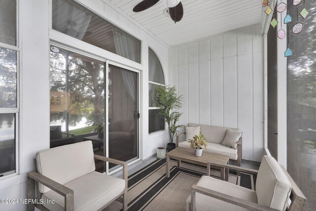 sunroom with ceiling fan and plenty of natural light