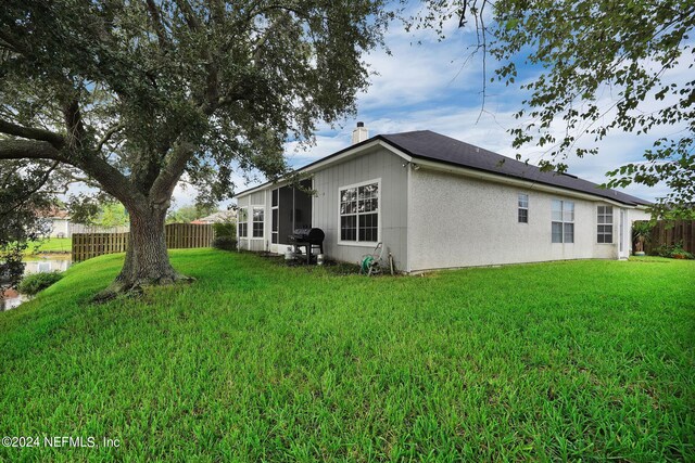 view of property exterior with a lawn