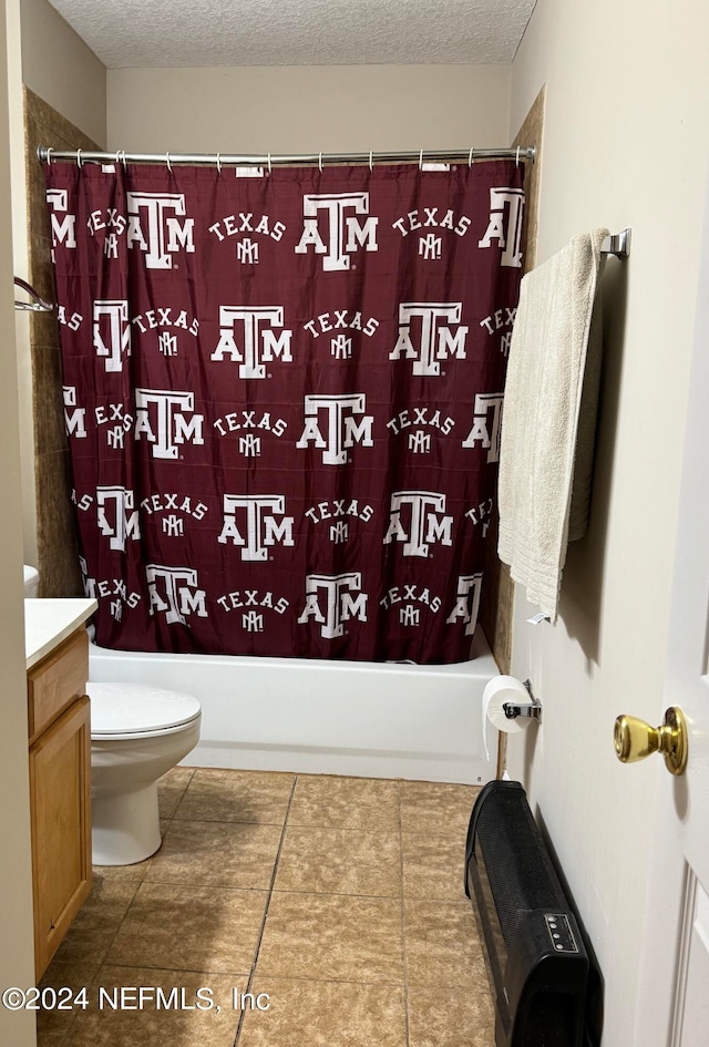 full bathroom featuring tile patterned flooring, toilet, shower / tub combo, vanity, and a textured ceiling