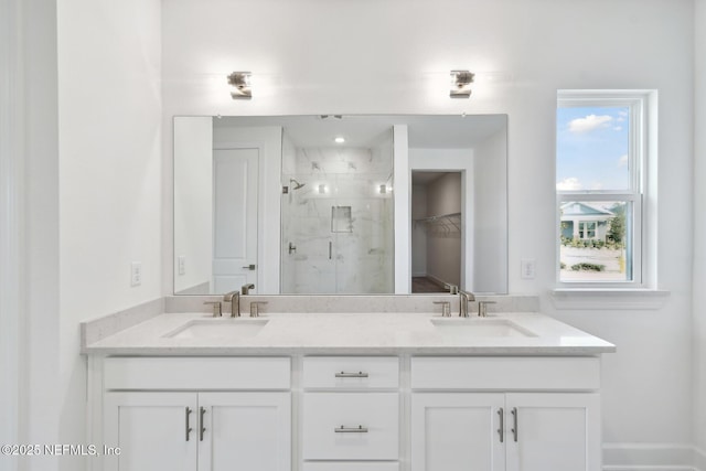 bathroom with vanity and a shower with shower door