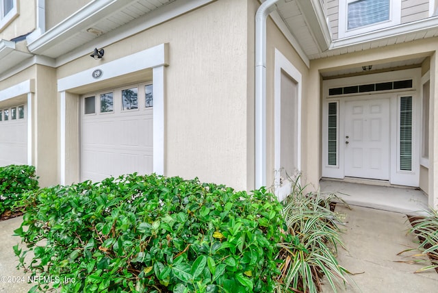 property entrance featuring a garage