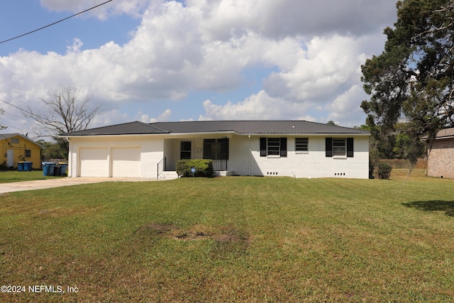 3037 Ribault Scenic Dr, Jacksonville, FL 32208 - ranch-style home with a front lawn, metal roof, an attached garage, and driveway