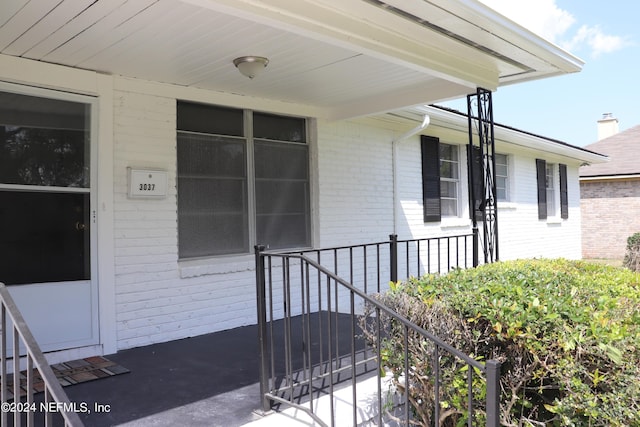 3037 Ribault Scenic Dr, Jacksonville, FL 32208 - doorway to property featuring brick siding