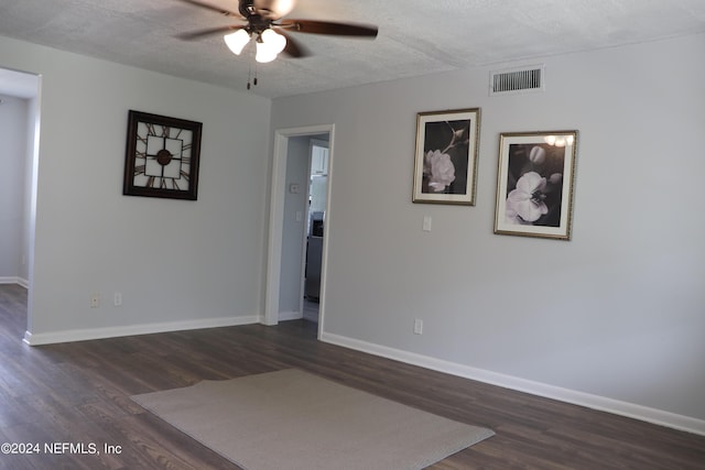 3037 Ribault Scenic Dr, Jacksonville, FL 32208 - spare room featuring dark wood-type flooring, baseboards, a textured ceiling, ceiling fan, and visible vents