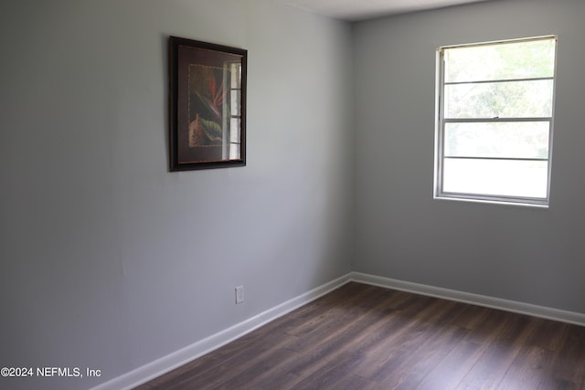 3037 Ribault Scenic Dr, Jacksonville, FL 32208 - unfurnished room with baseboards and dark wood-style floors