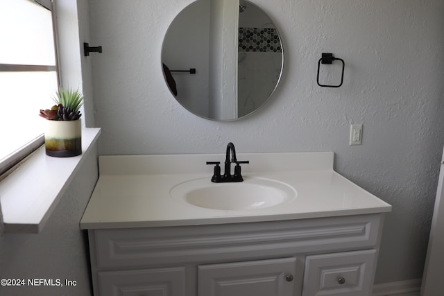3037 Ribault Scenic Dr, Jacksonville, FL 32208 - bathroom featuring a textured wall and vanity