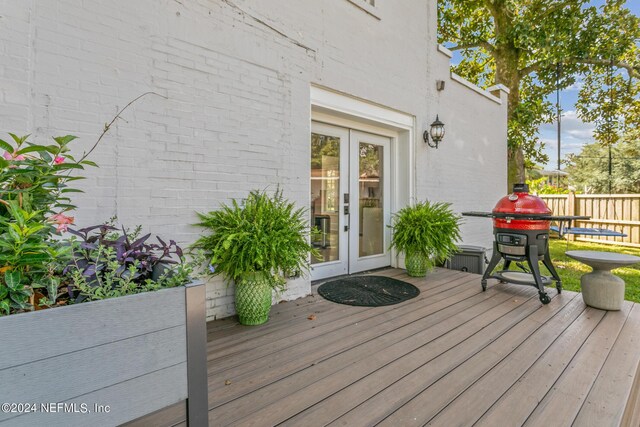 wooden terrace featuring french doors