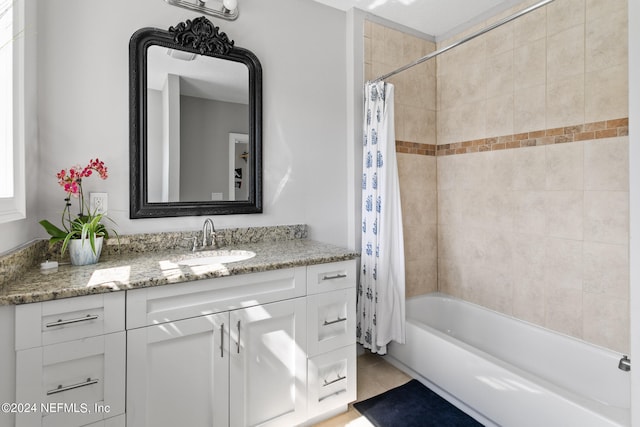 bathroom with shower / tub combo, vanity, and tile patterned floors