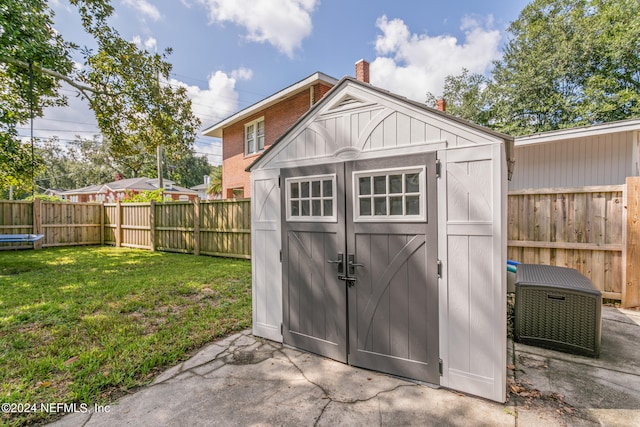 view of outdoor structure with a yard