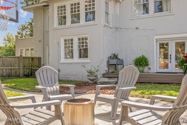 view of patio with a fire pit