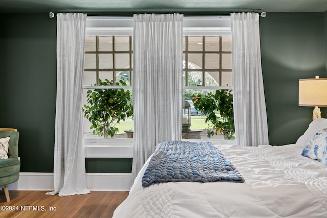 bedroom with wood-type flooring