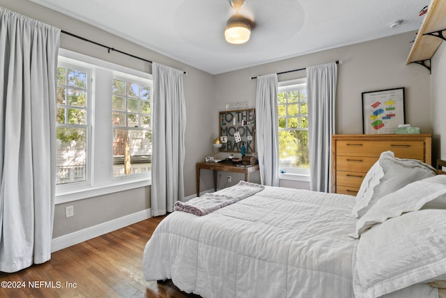 bedroom featuring ceiling fan and hardwood / wood-style flooring