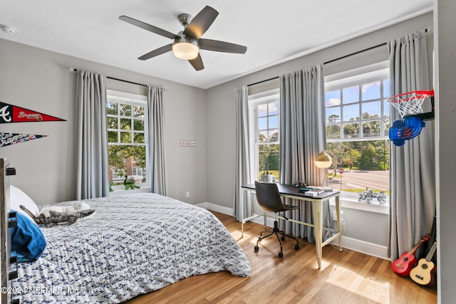 bedroom featuring ceiling fan and light hardwood / wood-style flooring