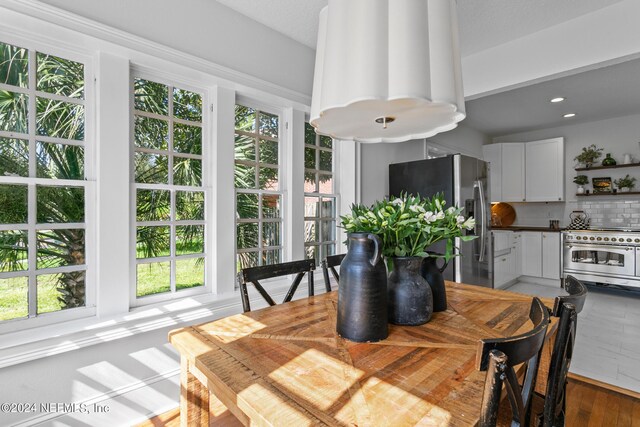 dining room with hardwood / wood-style floors