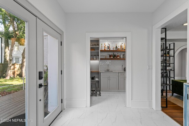 interior space with light hardwood / wood-style flooring and sink