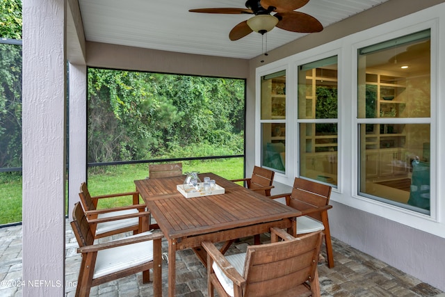 sunroom / solarium with ceiling fan