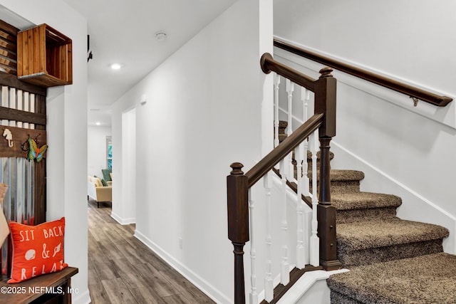 stairway with wood-type flooring