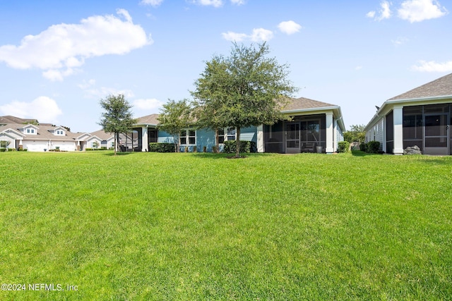 view of yard featuring a sunroom