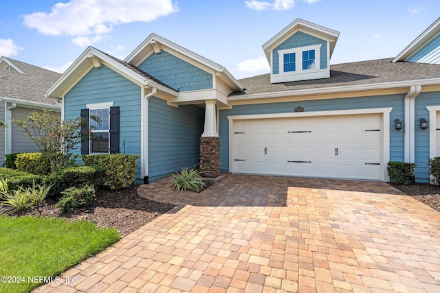 craftsman-style house featuring a garage