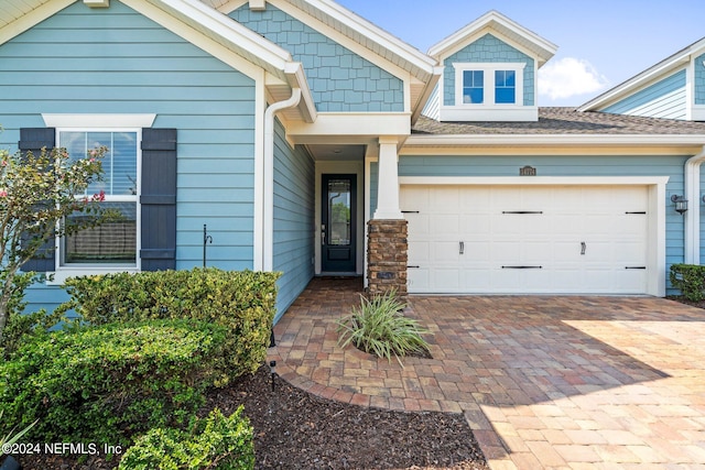 view of front of home with a garage