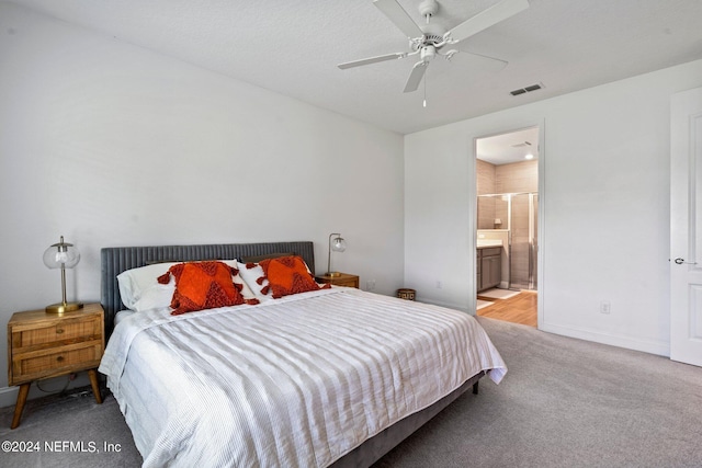 carpeted bedroom featuring ceiling fan and connected bathroom