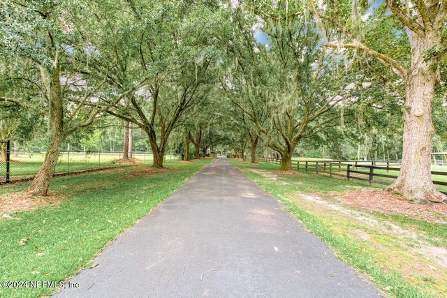 view of community with fence