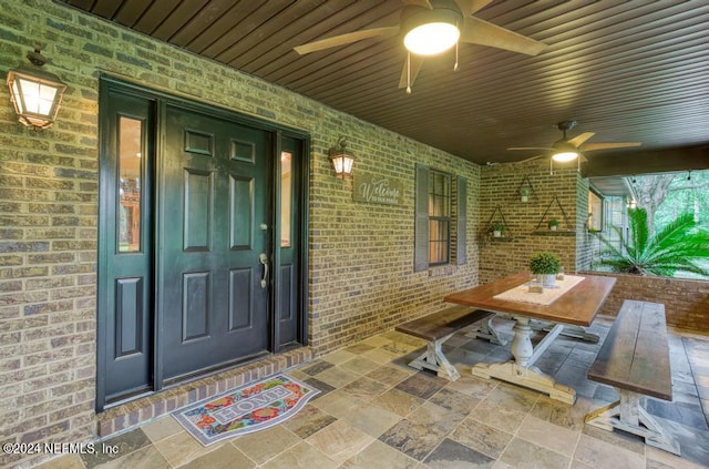 entrance to property featuring ceiling fan