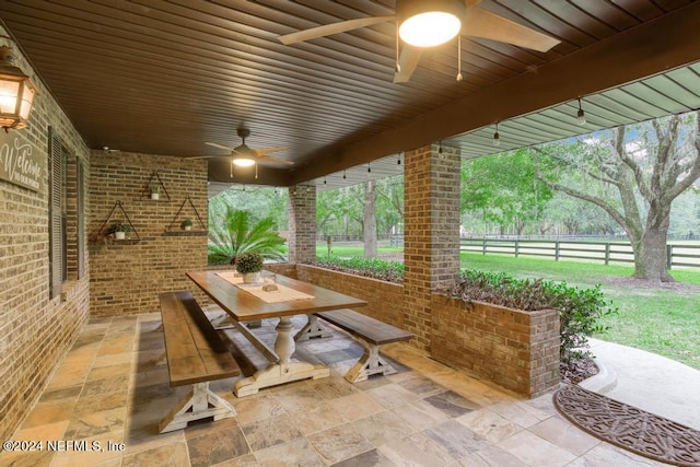 view of patio featuring ceiling fan