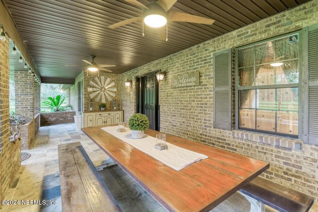 view of patio featuring ceiling fan