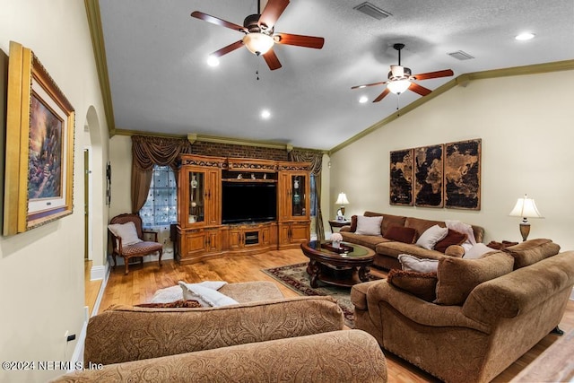 living room with light wood-type flooring, crown molding, and ceiling fan