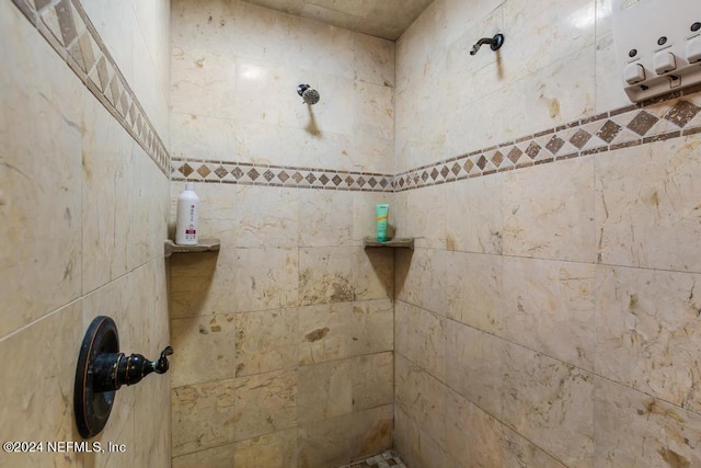 bathroom with a tile shower