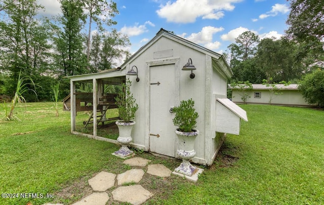 view of outdoor structure with a yard